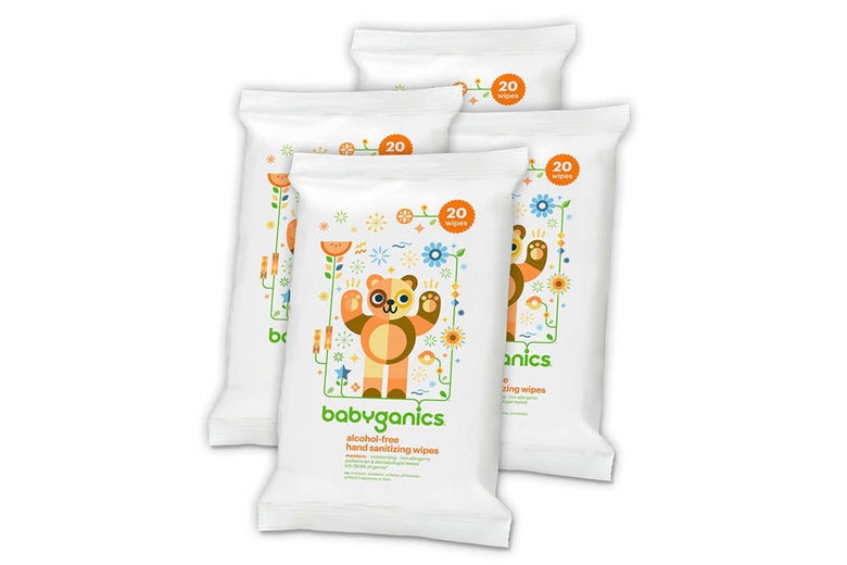 Three Babyganics packs of hand sanitizing wipes.